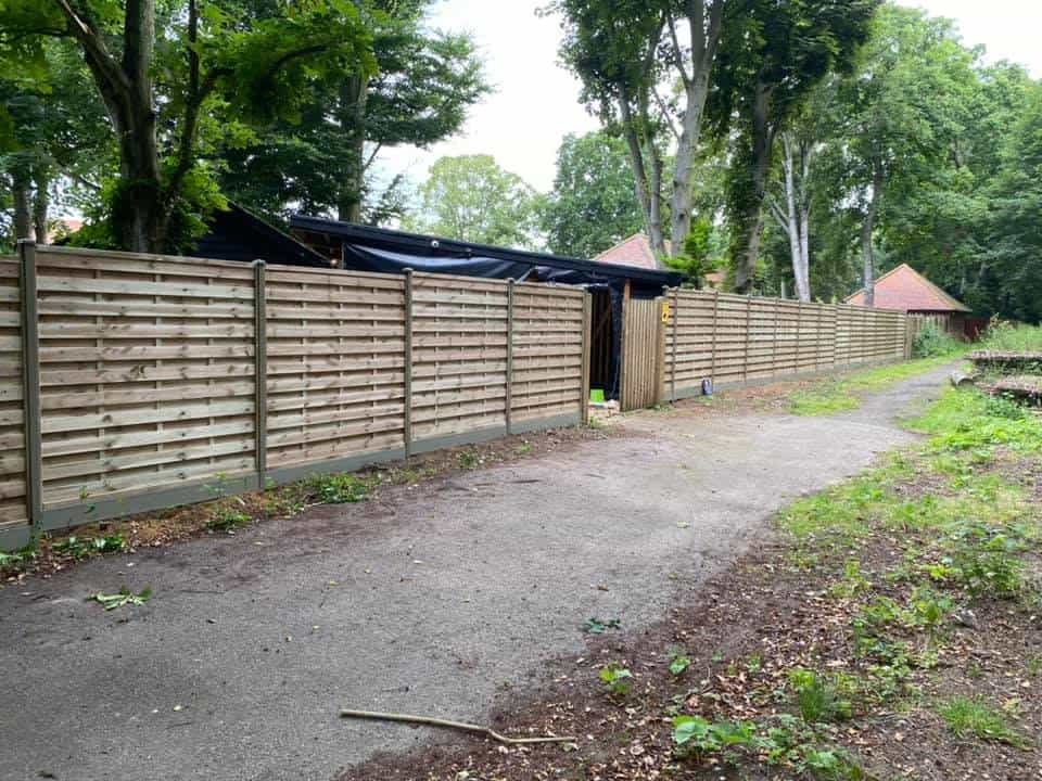 New wooden fence with duraposts installed by EM Fencing and Garden Services.