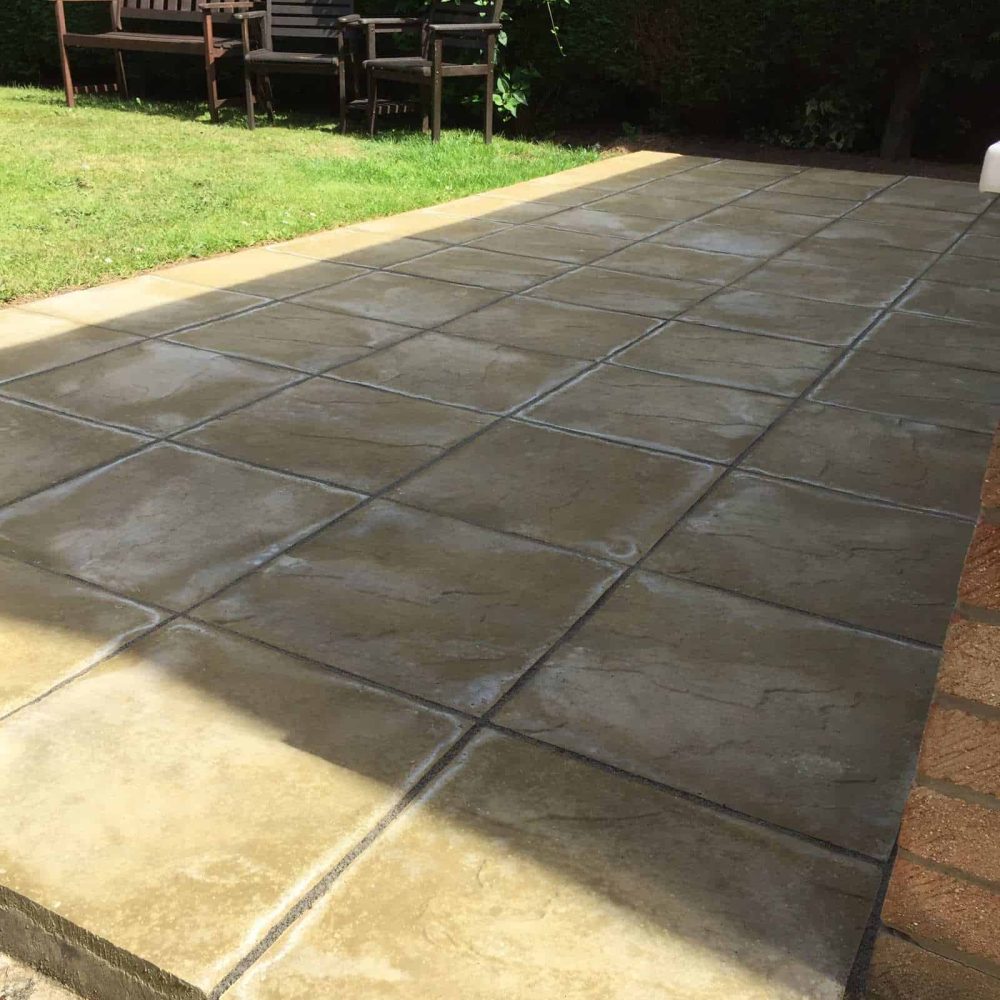 Newly laid concrete patio with garden seating area in Suffolk.