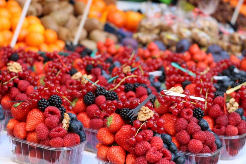 Punnets full of fresh berries at the market in Prague Old Town