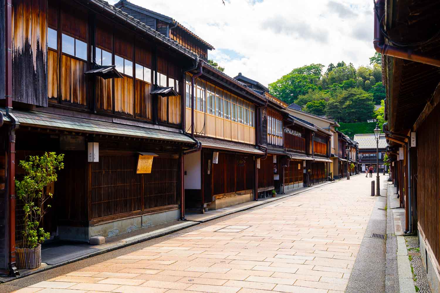Ancient wooden buildings line a quiet street in Kyoto, Japan, showcasing traditional architecture and historic charm. Perfect for exploring Japan's cultural heritage and scenic cityscapes.