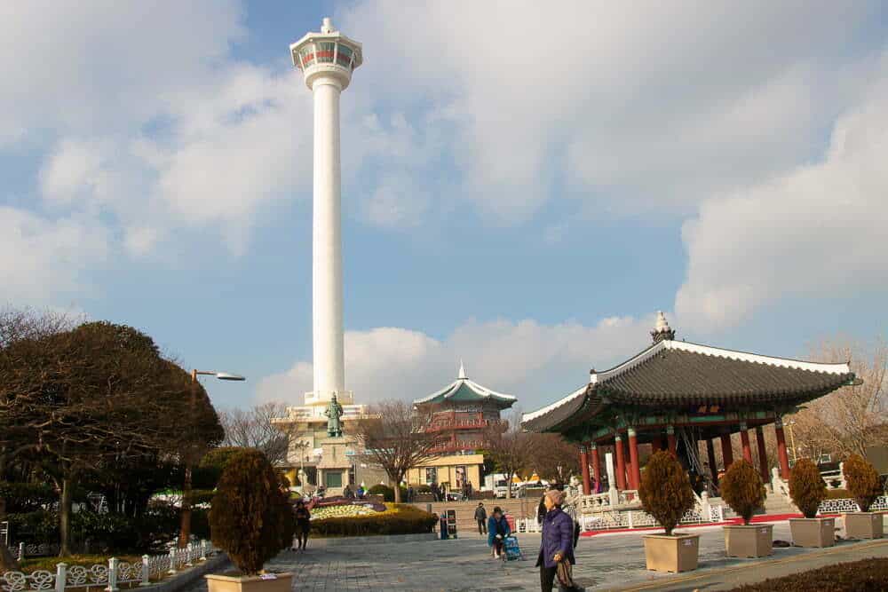 The white column of the tower stands out against the blue sky