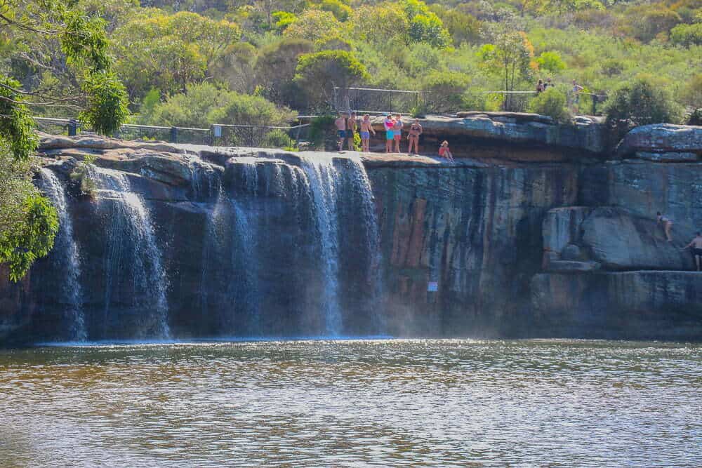 Waterfall at Taronga Zoo Sydney with visitors enjoying the scenic view.