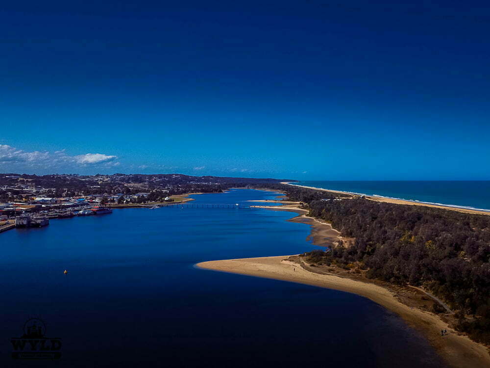 Serpentine River and coastline near Bateman's Bay, New South Wales, Australia, showcasing scenic views, calm waters, and lush greenery of the area.