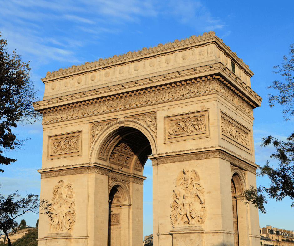 The Carved Memorial of the Arc De Triomph against blue sky