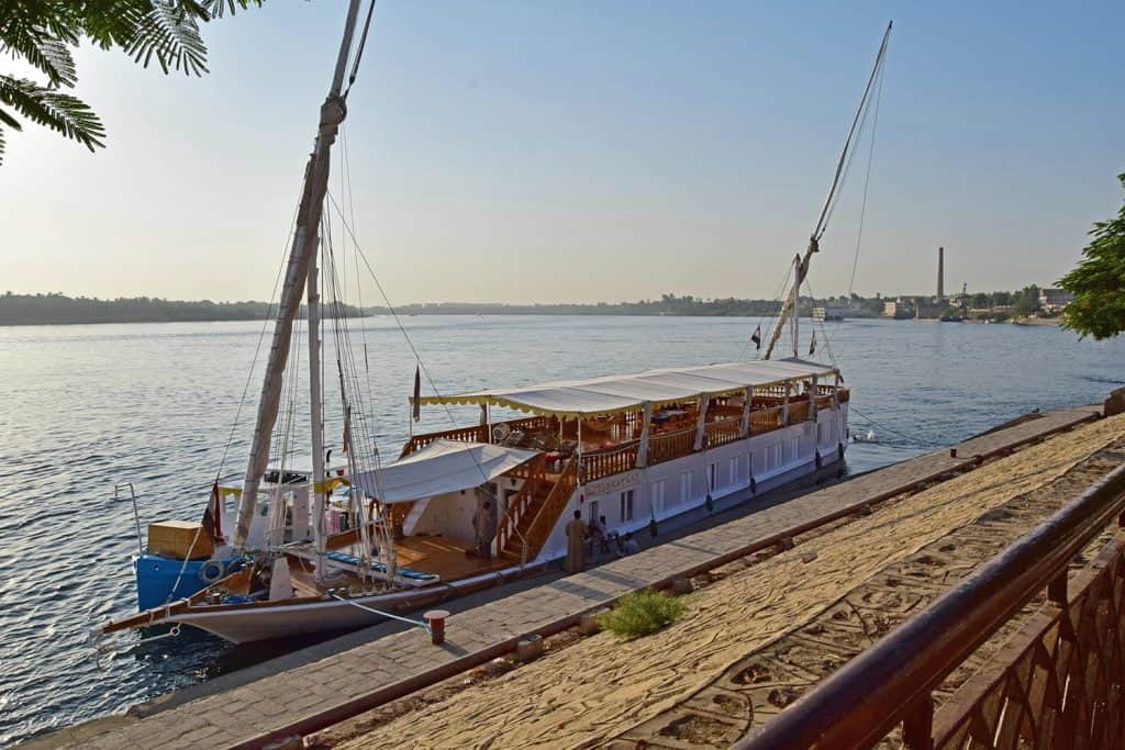 A Traditional Dahabiya boat moored on the banks of the Nile River