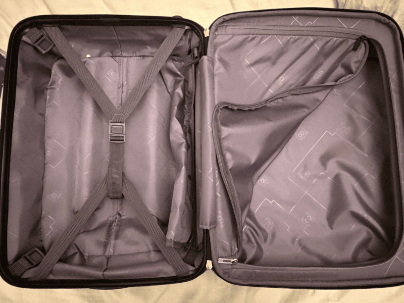 Emma Jane Explores: Inside the Level8 Grace suitcase showing organized packing compartments and secure straps for travel convenience.