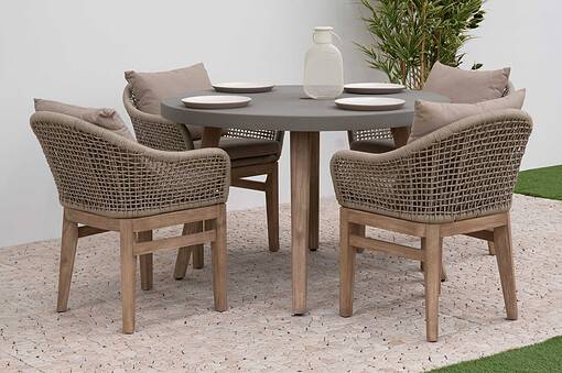 Stylish outdoor dining table set with six woven armchair seats, neutral cushions, and elegant tableware, perfect for garden entertaining and enhancing your home and garden decor.