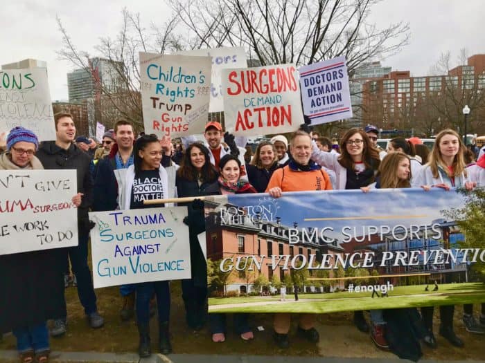Tracy Dechert, left, and other members of the socially responsible surgery group at Boston Medical Center attend the 2018 March for our Lives in Boston.