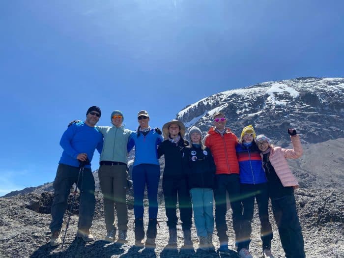 Nelson and McCue pose alongside fellow Courage Rising hikers at Mt. Kilimanjaro.