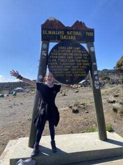 Isabella McCune stands at Shira Cave Camp.