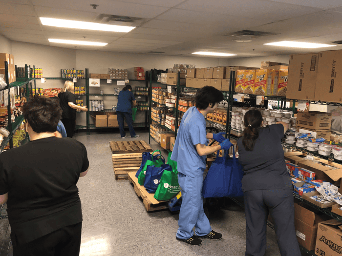 Nashville General Hospital staff prepare food totes for patients at the food pharmacy.