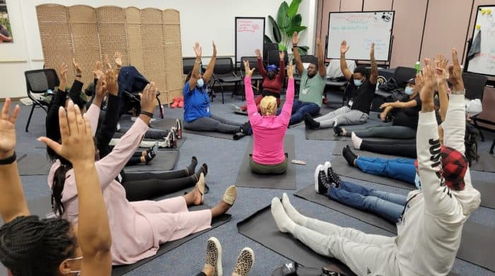 BElovedBIRTH trainer leads a group in prenatal fitness.