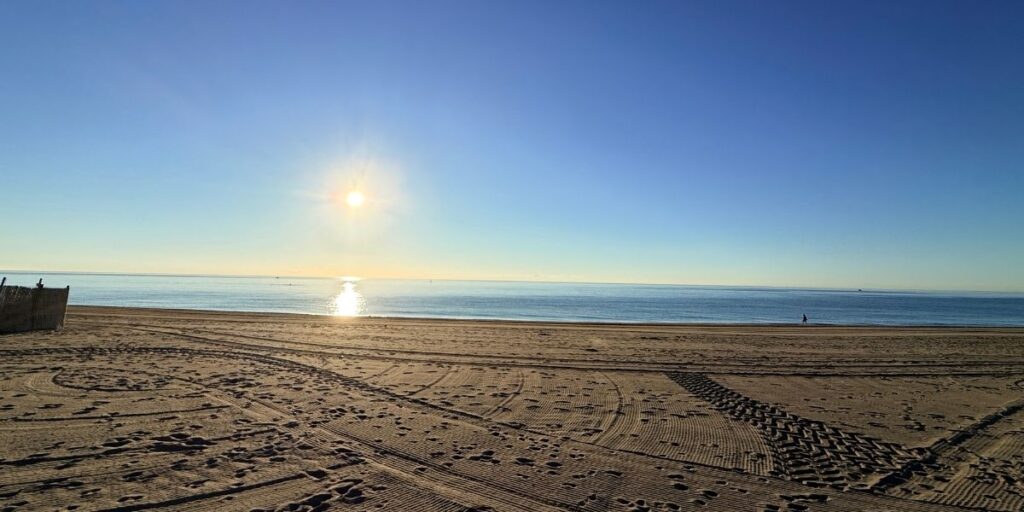 Beach with sun and ocean