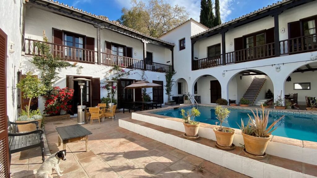 Hotels in Estepona with Swimming Pools Courtyard with pool and seating.