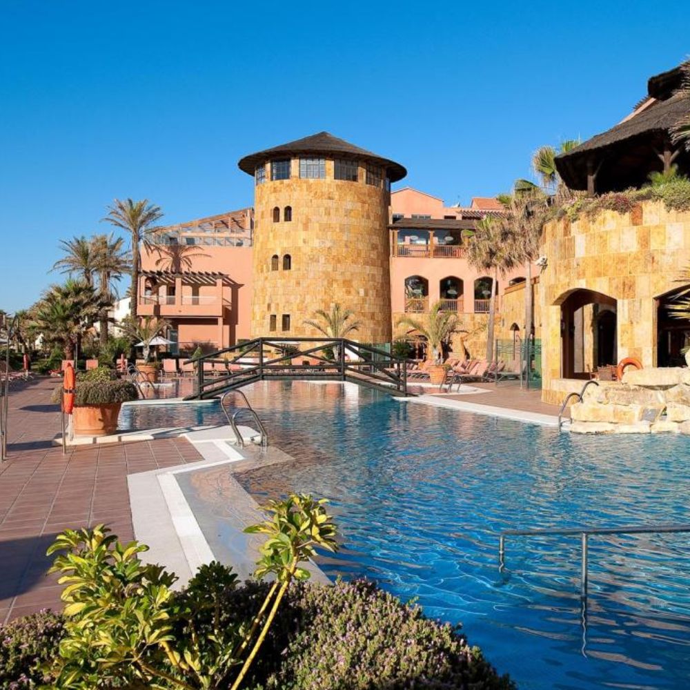 Resort pool with bridge and tower