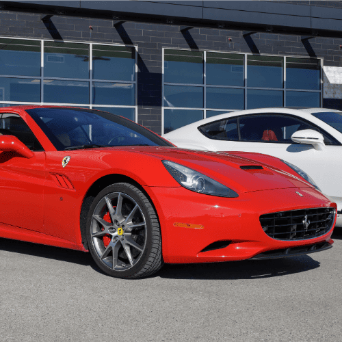 Ferrari sports car parked outside European Autoworks service center.