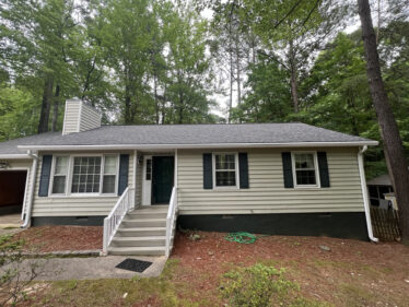 Clog-free gutter system installed on a house surrounded by trees in Cincinnati, Kentucky.
