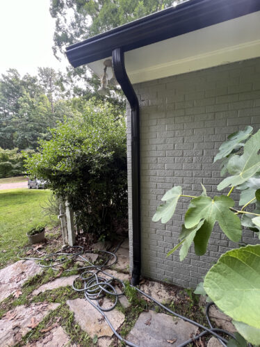 Efficient gutter protection system installed on house in Kentucky to prevent clogs and overflow.