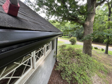 Gutter system with leaf guard prevents clogs and maintenance.