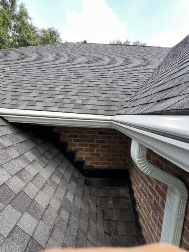 Efficient clog-free gutter system installation on a residential roof in Cincinnati, preventing water damage and ensuring proper drainage.