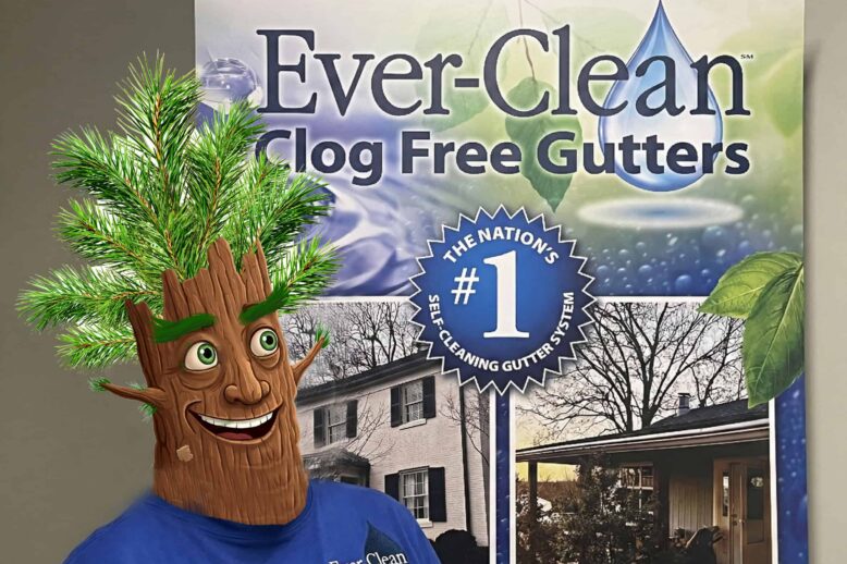 Cartoon tree mascot in front of a promotional poster for Ever-Clean Clog Free Gutters.