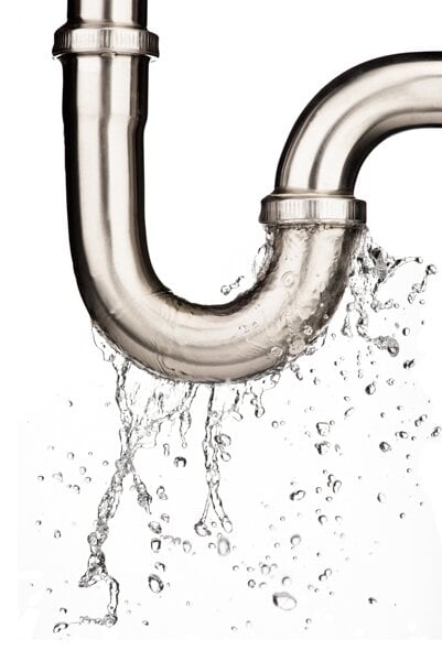 Water leaking from a metal pipe with an elbow joint against a white background.