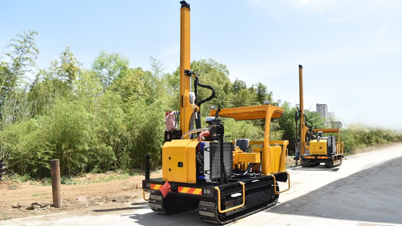Two small pile drivers parked at the project site