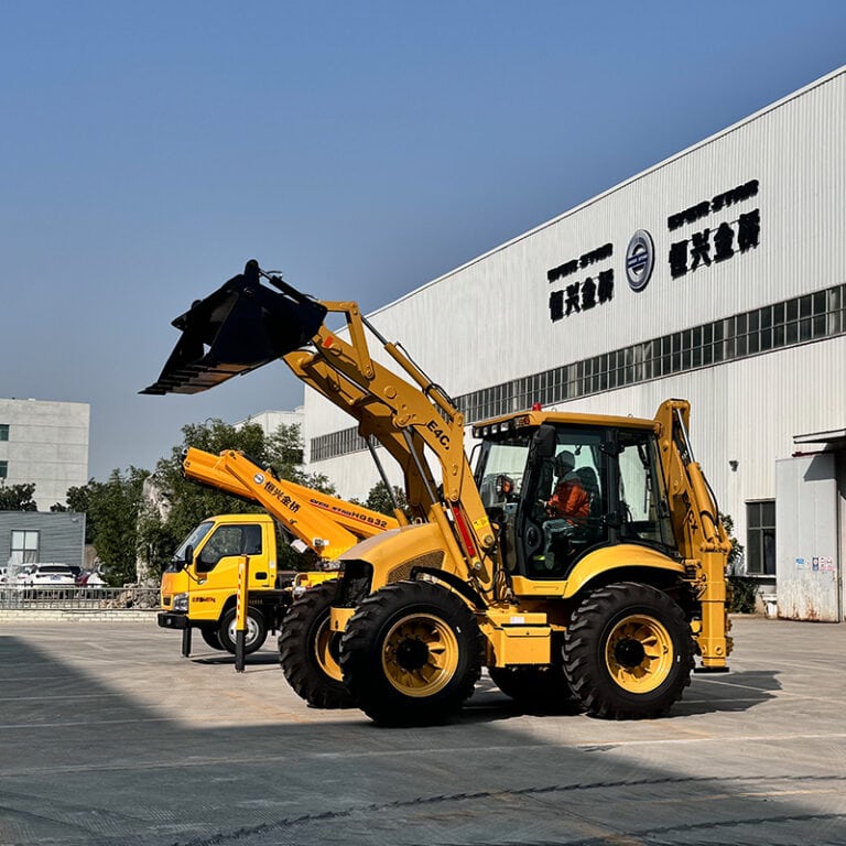 Backhoe loader with the loading bucket raised.