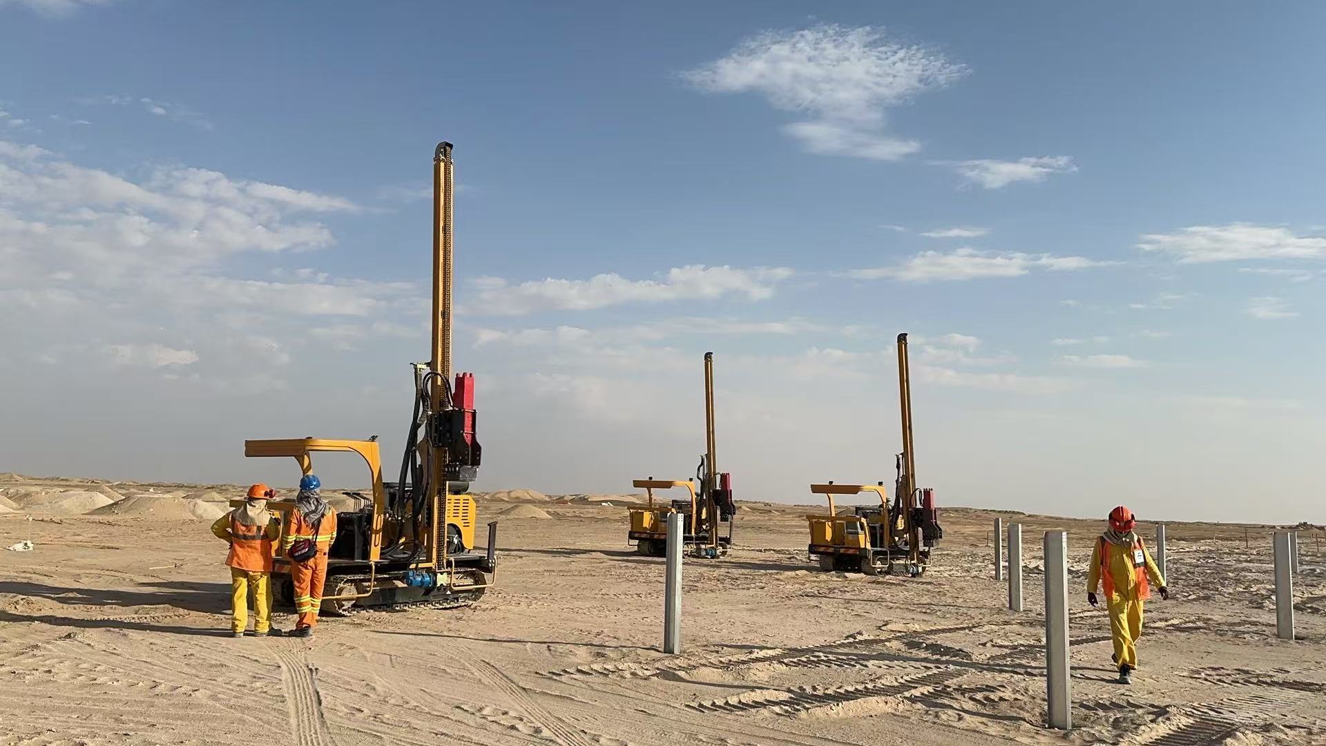 Solar Pile Drivers on construction site.