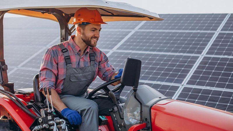 Operator worlking at a solar farm construction