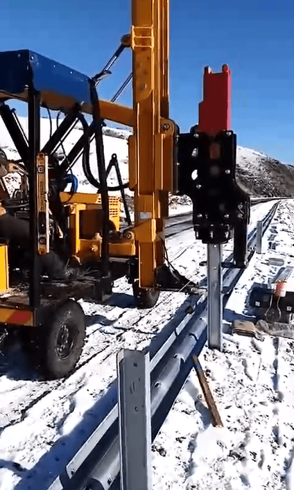 Ramming machine operating in a snowy landscape