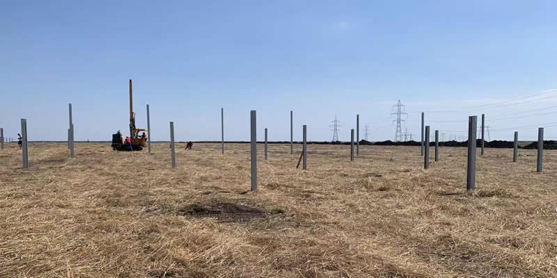 EVERSTAR: Solar pile driver in construction site.