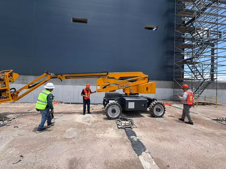 Articulating man lift at a construction site