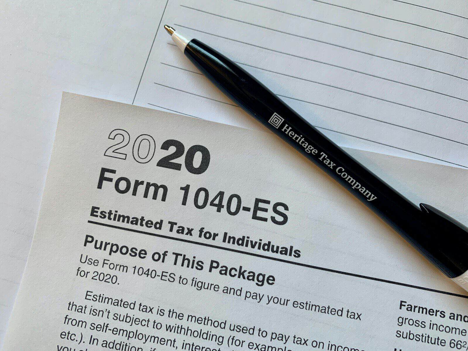 Form 1040-ES tax form with pen on paper for tax preparation.