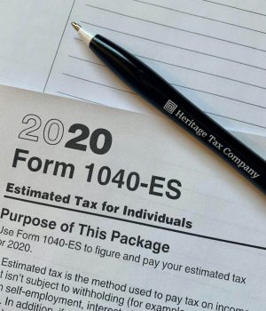 Form 1040-ES tax form with pen on paper for tax preparation.