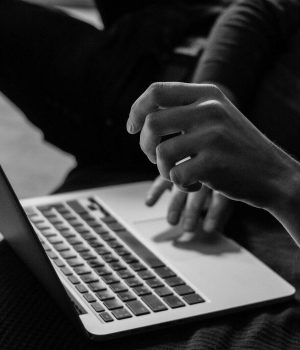 Person using a laptop for virtual tax prep and financial planning.