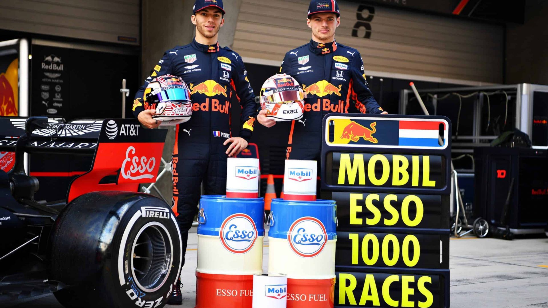 F1 Grand Prix of China - Previews SHANGHAI, CHINA - APRIL 11: Max Verstappen of Netherlands and Red Bull Racing and Pierre Gasly of France and Red Bull Racing pose for a photo with heritage Esso and Mobil cans to commemorate the 1000th Formula One race during previews ahead of the F1 Grand Prix of China at Shanghai International Circuit on April 11, 2019 in Shanghai, China. (Photo by Clive Mason/Getty Images) // Getty Images / Red Bull Content Pool // AP-1YZG19M4W2111 // Usage for editorial use only //