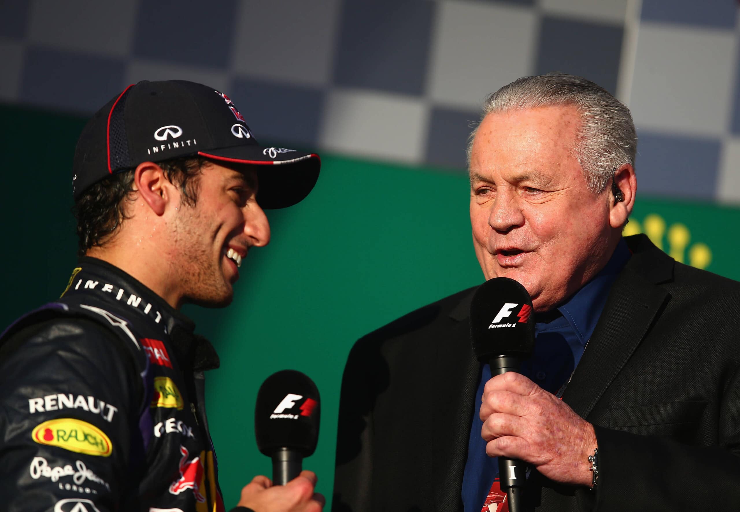 MELBOURNE, AUSTRALIA - MARCH 16: Daniel Ricciardo of Australia and Infiniti Red Bull Racing is interviewed on the podium by Alan Jones after finishing second during the Australian Formula One Grand Prix at Albert Park on March 16, 2014 in Melbourne, Australia. (Photo by Clive Mason/Getty Images) *** Local Caption *** Daniel Ricciardo; Alan Jones // Getty Images / Red Bull Content Pool // SI2014121810280 // Usage for editorial use only //