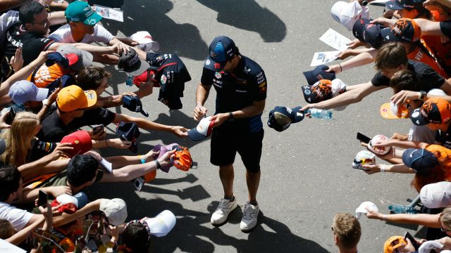 SPIELBERG, AUSTRIA - JUNE 30: Sergio Perez of Mexico and Oracle Red Bull Racing signs autographs for fans as he arrives at the circuit prior to the F1 Grand Prix of Austria at Red Bull Ring on June 30, 2024 in Spielberg, Austria. (Photo by Chris Graythen/Getty Images) // Getty Images / Red Bull Content Pool // SI202406300097 // Usage for editorial use only //
