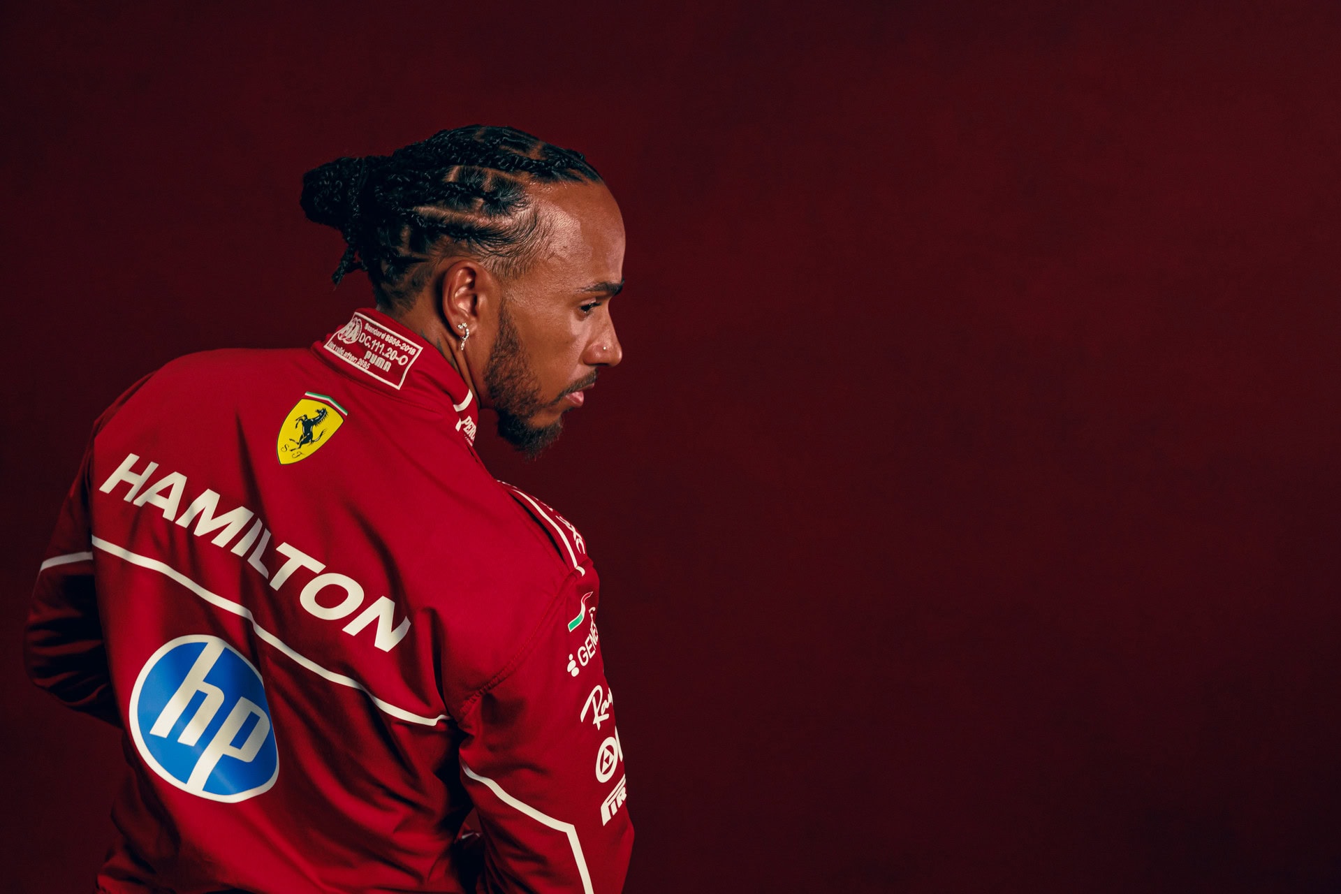 Lewis Hamilton 2025 Red Background 03 D0a70f9e 8649 4278 85bd F1eb8f0ceb0e
