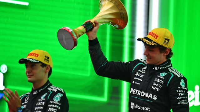 SHANGHAI, CHINA - MARCH 15: Race winner Andrea Kimi Antonelli of Italy and Mercedes AMG Petronas F1 Team lifts his trophy on the podium during the F1 Grand Prix of China at Shanghai International Circuit on March 15, 2026 in Shanghai, China. (Photo by James Sutton/LAT Images)