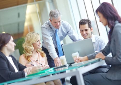 a business team discussing options to unlock cash with invoice financing