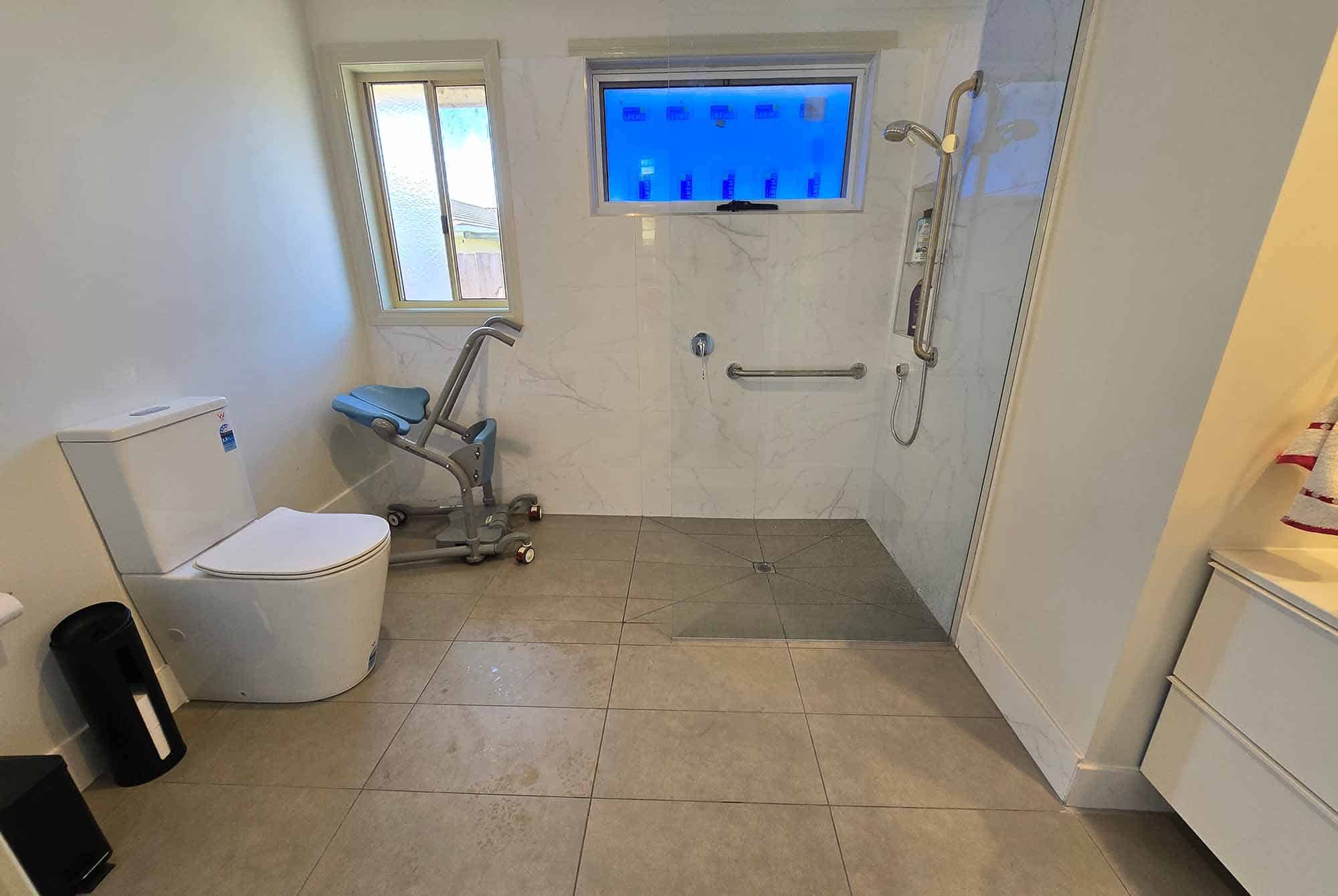 Accessible bathroom with walk-in shower and modern fixtures.