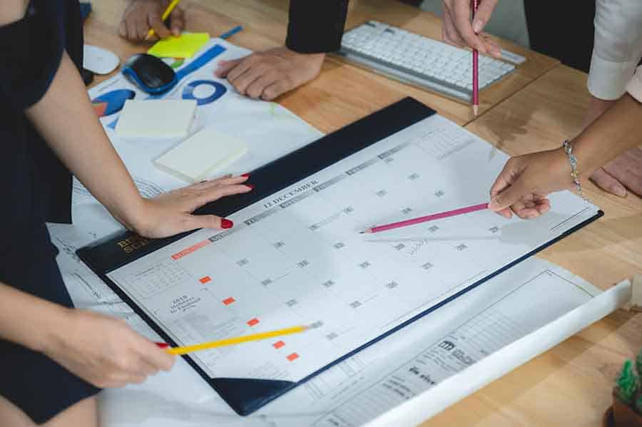 Architectural project planning with team members.