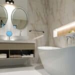 Elegant bathroom featuring a stylish freestanding bathtub and contemporary design elements.