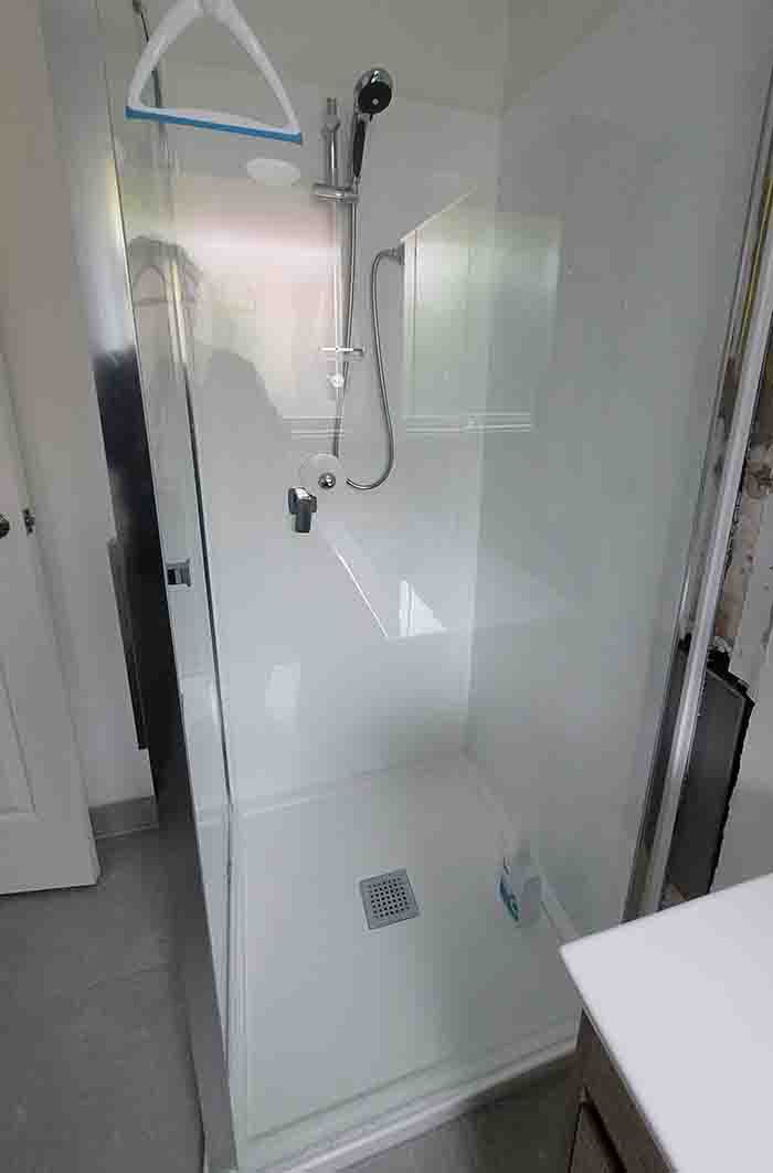 Modern shower panel with multiple spray options and sleek design.