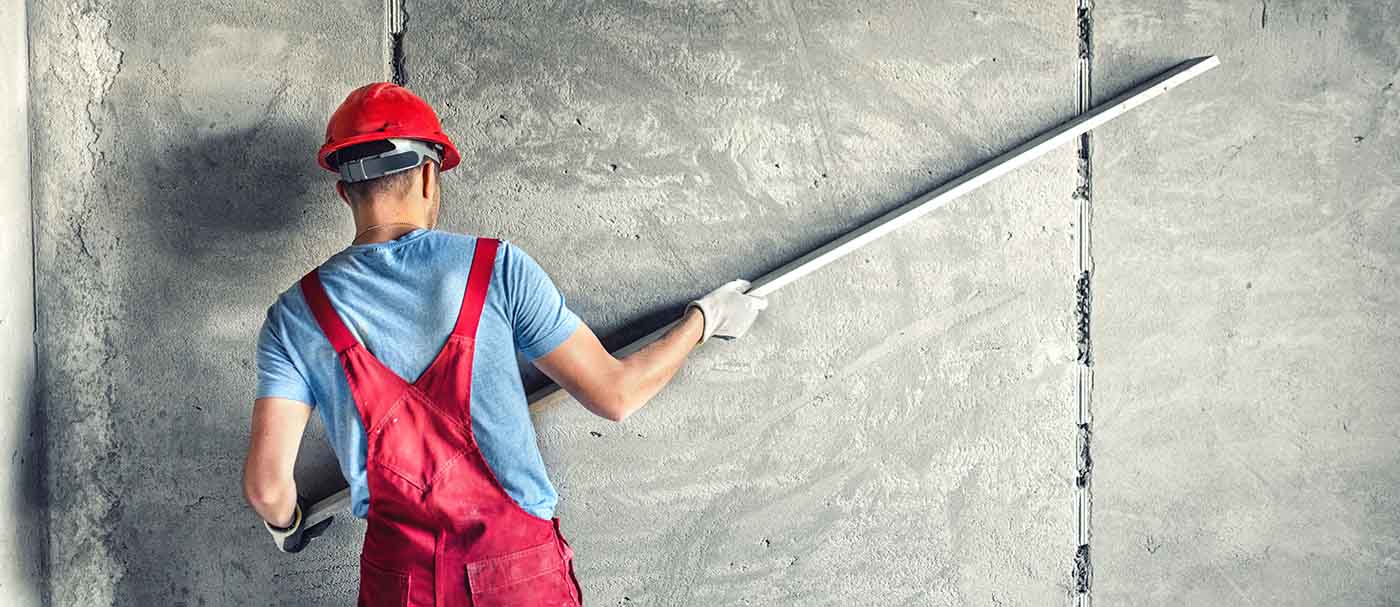 Mud floated walls in bathroom construction for a smooth, durable finish.