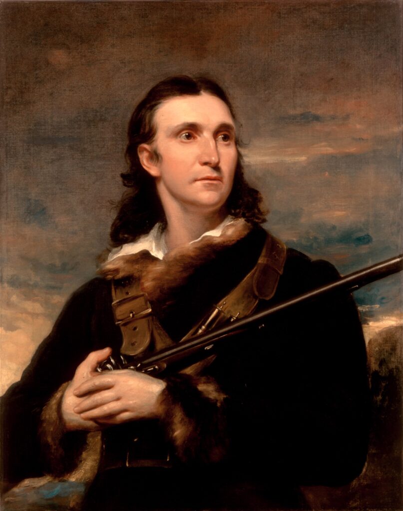 Portrait of John James Audubon holding a rifle, wearing a fur-trimmed coat against a scenic background. This historical image captures Audubon's adventurous spirit.