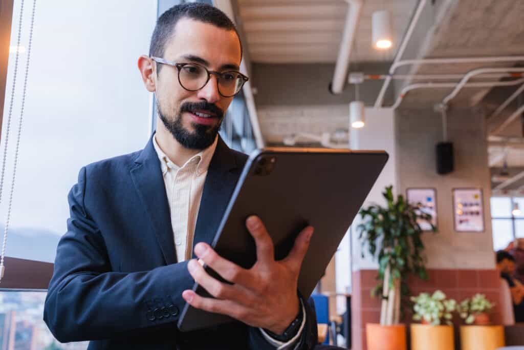 Manager reviewing real customer feedback to guide team coaching