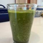 Picture of a pint glass filled with Kale & Citrus Green Juice.